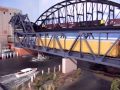 long  union pacific mixed train   crossing a walthers bascule bridge    look for size 21 auto rack