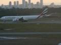 Emirates A340-500 landing and taxiing to Perth airport