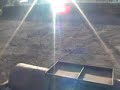 Rolling a field after sowing grass seed.New Holland