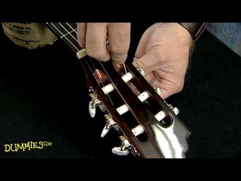 how to fasten classical guitar strings