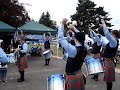 SFU DRUM CORPS practice 2008 with flourishing tenors. J Reid Maxwell, Drum Sgt. The six tenors - (l-r in circle) Brittany Angeltvedt, Simone Reid, Michael O'Neil, Katey MacPherson, Blake Schmidt, James Marshall and Kathryn Tawse (bass).