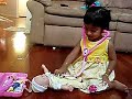 Shreya plays with the medical kit toy