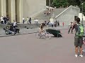 Skater jumps over trackstanding cyclist at Palais de Challoit, Paris