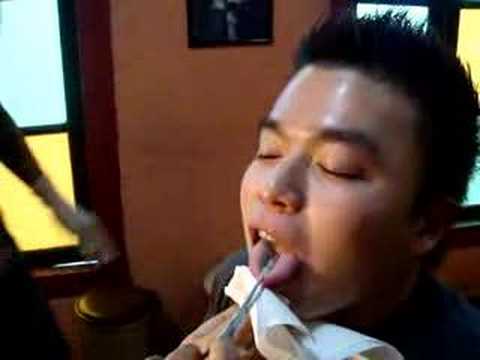 Full video of tongue piercing done at Borneo Headhunters Full video of tongue piercing done at Borneo Headhunters