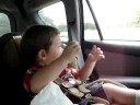 Some kid feeding bison