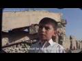 Young Ali, age 9, from Afganistan on his three ruined homes