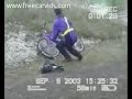 Bicyclists watch car and trailer roll down hill