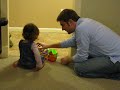 Claire and Martin playing with her Little People train