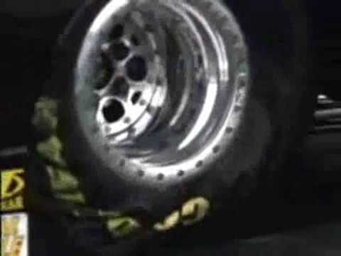 racing tires - High FPS camera catching every detail of a drag racing start including the buckling of the tryes and each individual exhaust blow.