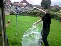 big water ballon being popped in slow motion