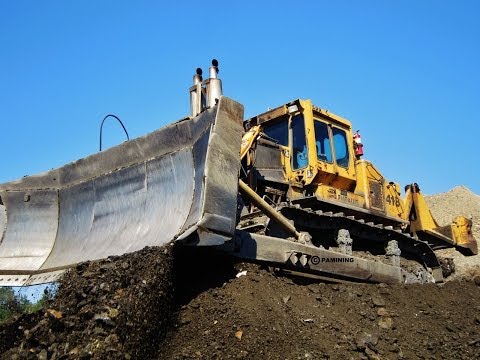 Allis - A 1982 Fiat-Allis stripping clay and pushing it down to a Caterpillar 992 to be loaded into trucks and hauled away. Once the clay is stripped down to the roc...
