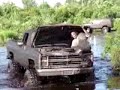 bogging A bad ass truck & CAR in the mud.