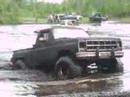 bogging A bad ass truck & CAR in the mud.