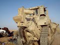 Armored D9 Dozer crushing cars in Iraq