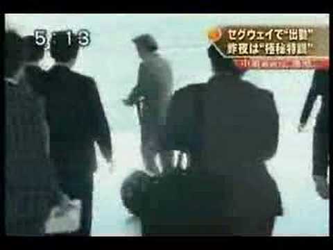 koizumi rides on a Segway
