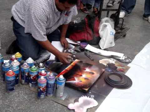 aerosol - Este es un chavo que esta pintando un cuadro con solo utilizar pintura en spray, es cabron oh no?'