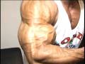 Bodybuilder Armon Adibi trains legs, poses arms