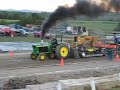 john deere tractor pulling in the enhanced class.... full pull !!

this is not a carbon neutral event, lol. the black smoke you see is the result of burning lots of diesel with some water/alcohol injection.