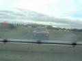 rear view racing alfasud v's alfa 105 gtv on a damp track