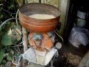 the corn   MILL/GRINDER,   of my neighbour