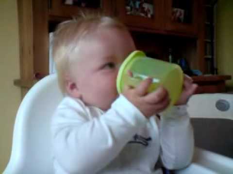 Leo child laughs loudly while drinking water has