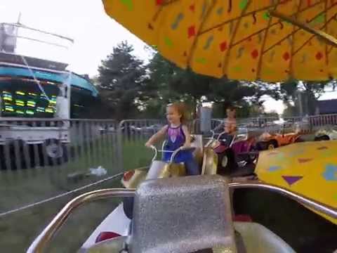 video still of children on an ATV midway ride at the Carver County Fair