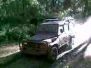 landrover defender extreme in bog hole at mount robertson