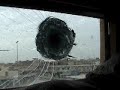Amazing video of a sniper attempting to kill one of our soldiers but the bullet proof glass saved him. Warning: Contains explicit language