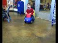 Noah riding a baby-car