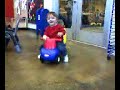 Noah riding a baby-car