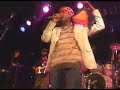 K-OSS PERFORMING BACKED BY ROOTS HARMONICS