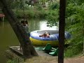 mom and daughter jumping in lake