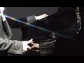 korean guy playing a piano with eight hands