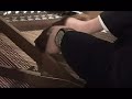 korean guy playing a piano with eight hands