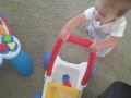 Kate walking the lawn mower