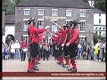 The Ironmen dancing the Much Wenlock Stick Dance in Ironbridge, Shropshire. May 1995. Dancers: Pete Leigh, Mark Walmsley, Ivor Phillips, Tony Farrington, Gerald Hannon, Mike Hollingsworth, Paul Tunnicliffe and Brian McGarvey. Musicians: Jake Wheeler (snare drum), Liz Stevenson (drum), Rachel Hunt (melodeon), Adele Rawlinson (melodeon) and Chris Hall (accordion). www.ironmenandseverngilders.org.