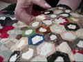 Patchwork  demonstration removing papers from hexagons 3