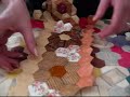 Patchwork  demonstration removing papers from hexagons 3
