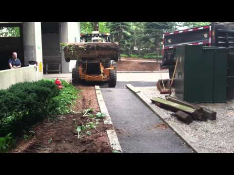 Case590 - we are digging out a footing for a concrete base so we are lading the excess fill.