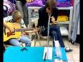 The Maine: John and a little boy playing acoustic.