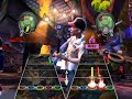 thiago jogando Guitar Hero 3