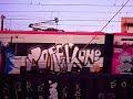 GRAFFITI ON A TRAIN IN MOVEMENT