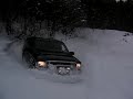 Ford Excursion playing in snow