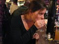 nice girl takes taquilla shot in coffeeshop / bar