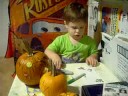 Lukie decorates pumpkins