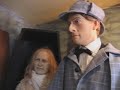 friendly guard,dressed as a victorian london bobby outside the museum. this interesting museum (upstairs) contains several canonical rooms and an elaborate reconstruction of the famous sitting room, which holmes and watson occupied at n 221b baker street. on the ground floor is a comprehensive gift shop, stocking a wide range of items related to our heroes and their many adventures. the museum also displays a unqiue waxworks exhibition of characters from the sherlock holmes stories. ... the ...