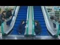 Mourners weep at escalator used by Kim Jong-il
