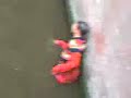 Drunk men in the canal of Amsterdam Drunk men in the canal of Amsterdam