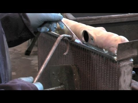 Recoring a Jaguar E-type radiator with an upgraded copper and brass core.