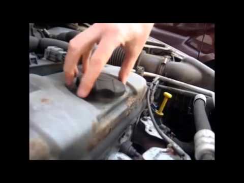 How to top up engine oil (shown on Peugeot 206)